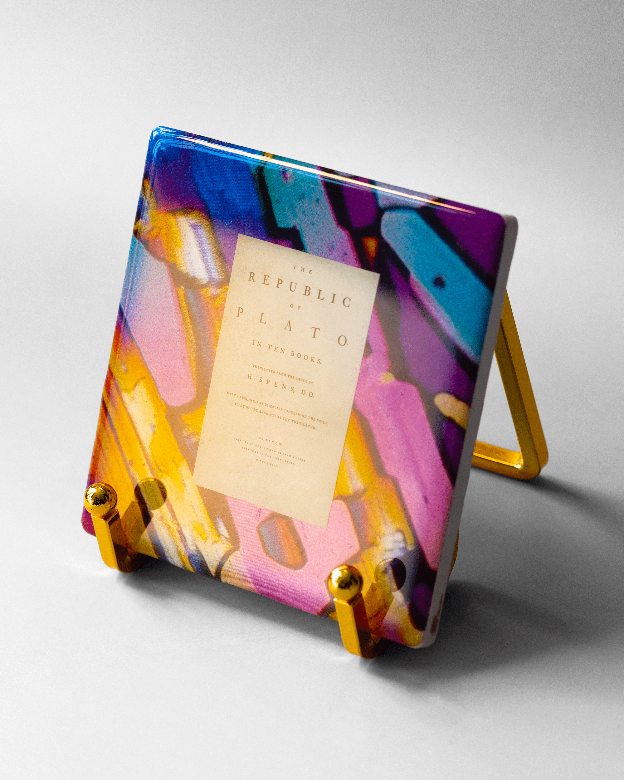Plato’s Republic x Microscopy | Display Coaster - Quantum Sunshine - No stand. Handmade art tile featuring vivid microscopy sealed in resin. Science-inspired wearable art and meaningful science gift for doctors and STEM professionals. History and resistance home decor. Side.