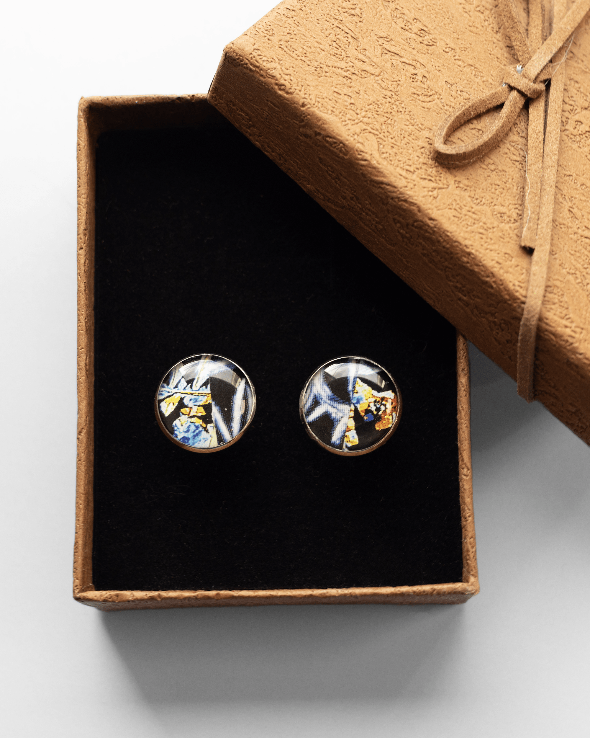 Handmade estrogen and testosterone microscopy cufflinks in resin and silver-plated brass. Unique science jewelry symbolizing balance and identity.