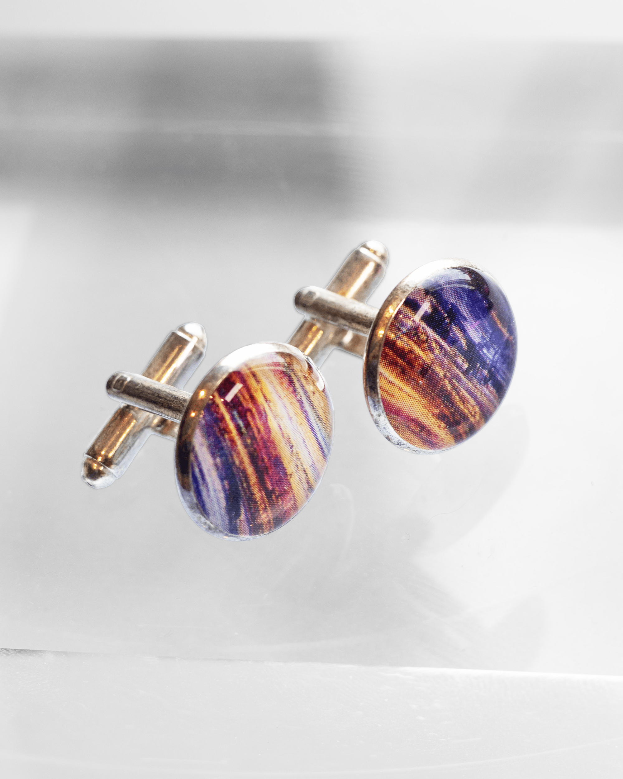 Handmade caffeine molecule microscopy cufflinks in silver-plated brass with resin finish. Science jewelry gift for doctors and STEM professionals. Side profile.