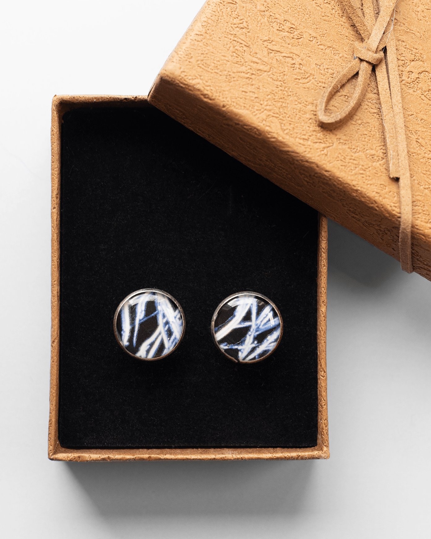 Handcrafted testosterone molecule microscopy cufflinks in silver-plated brass with resin finish. Bold science jewelry gift for people in STEM.