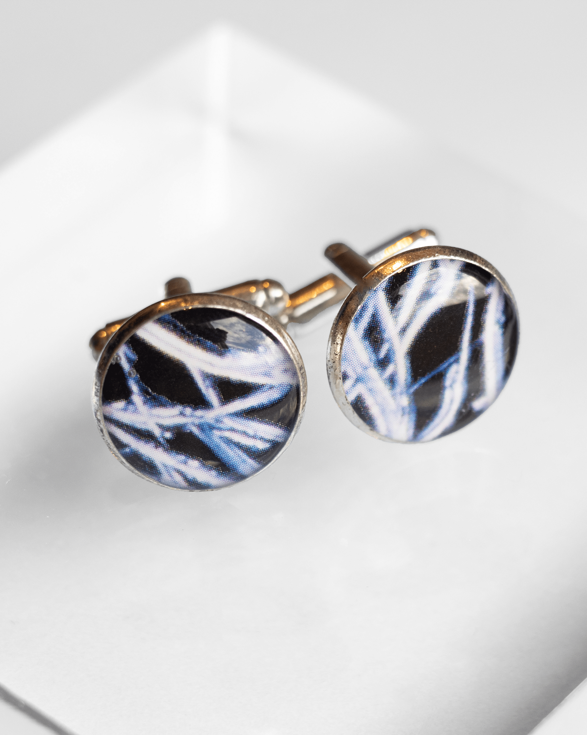 Handcrafted testosterone molecule microscopy cufflinks in silver-plated brass with resin finish. Bold science jewelry gift for people in STEM. Up close.