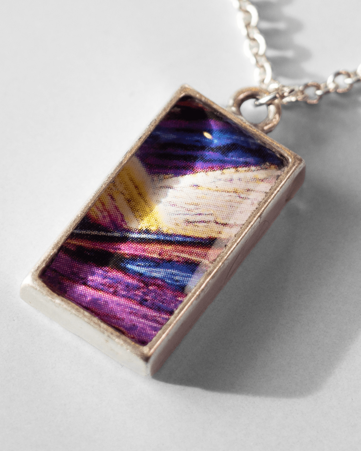 Arresting Necklace - Quantum Sunshine. Handmade jewelry featuring vivid microscopy sealed in resin. Science-inspired wearable art and meaningful science gift for doctors and STEM professionals. Macro.
