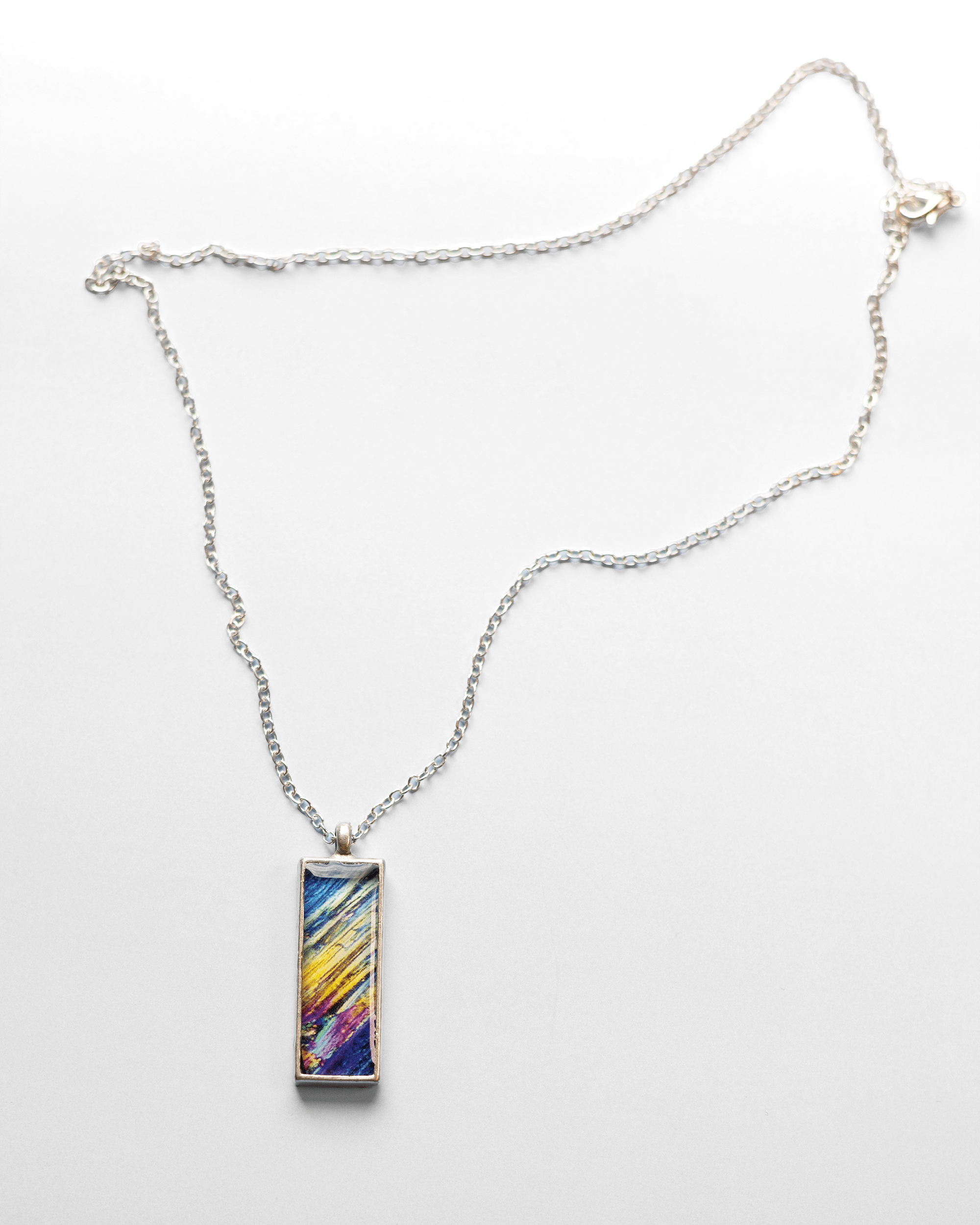 Rush Necklace - Quantum Sunshine. Handmade jewelry featuring vivid microscopy sealed in resin. Science-inspired wearable art and meaningful science gift for doctors and STEM professionals. Full.
