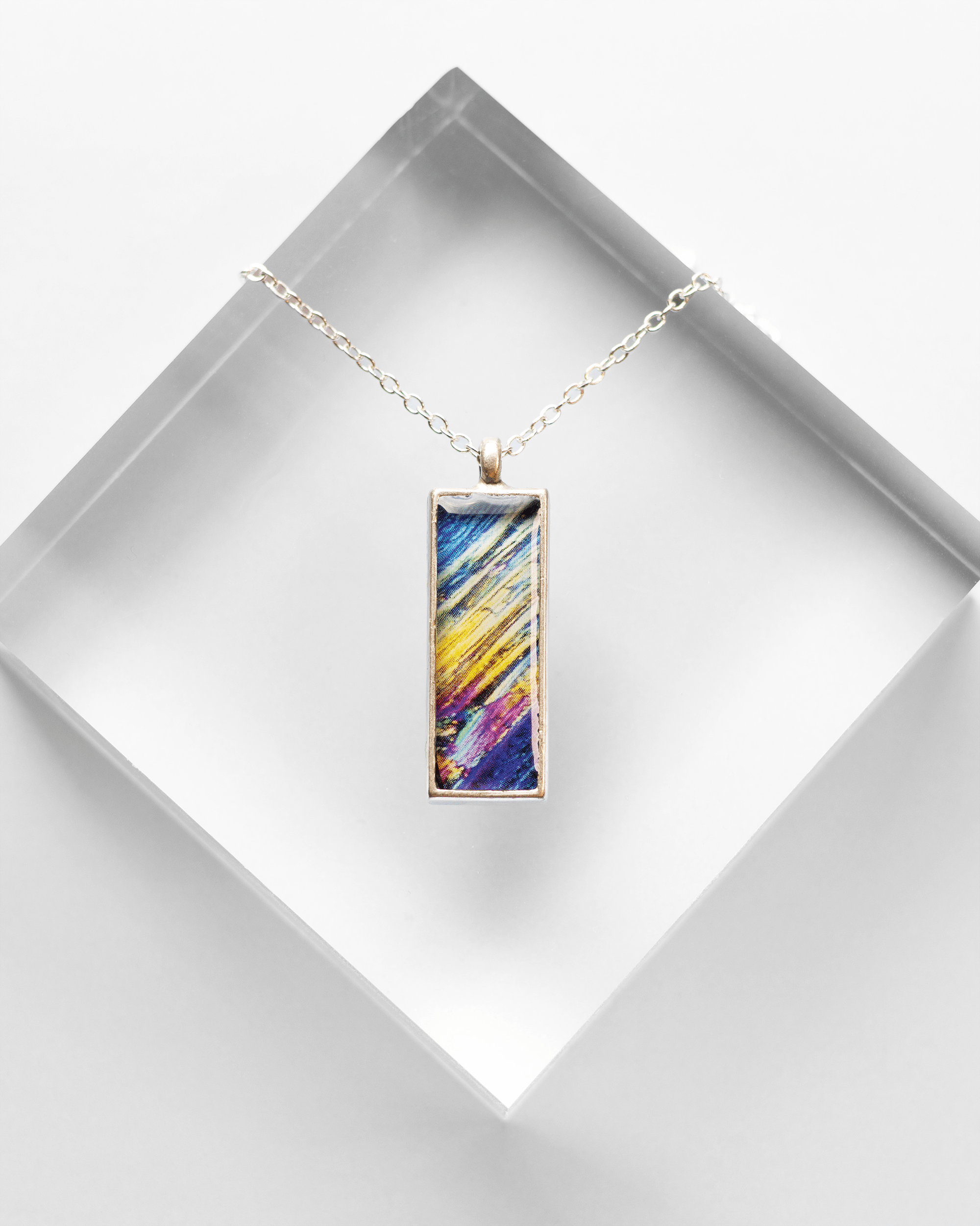 Rush Necklace - Quantum Sunshine. Handmade jewelry featuring vivid microscopy sealed in resin. Science-inspired wearable art and meaningful science gift for doctors and STEM professionals.