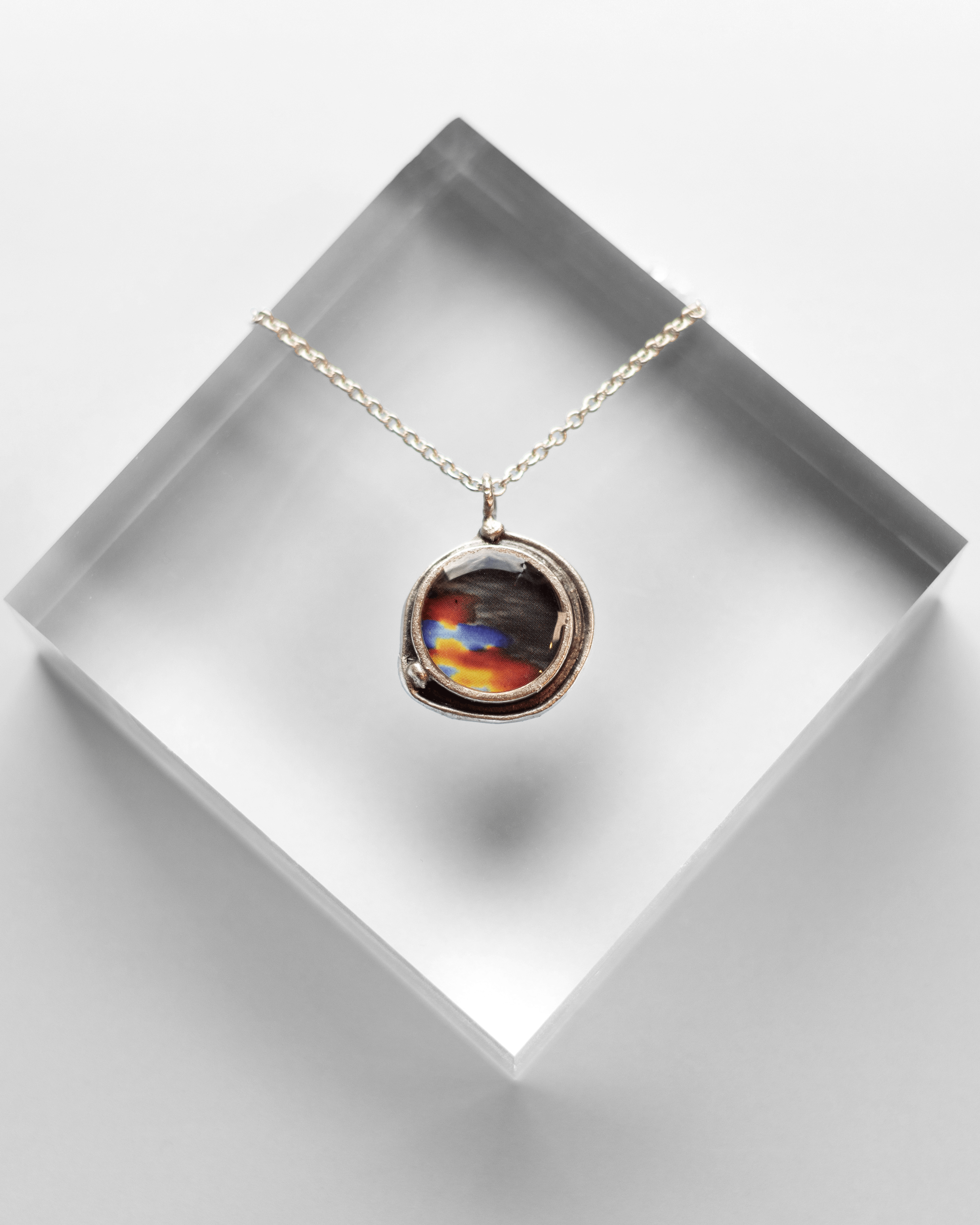 Handmade ultrasound heartbeat necklace in resin. Colorful, wearable science art pendant honoring rhythm, emotion, and vitality.
