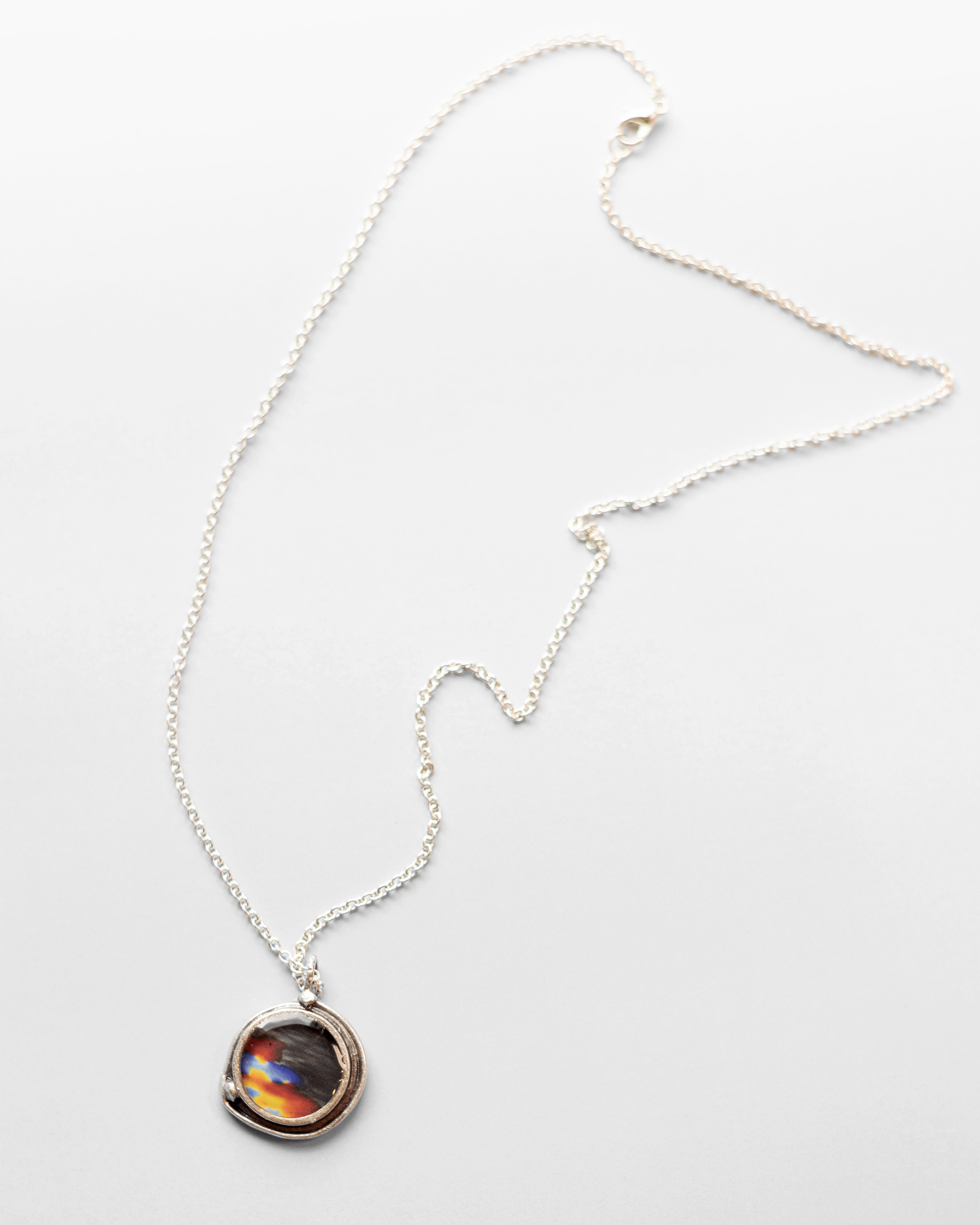 Handmade ultrasound heartbeat necklace in resin. Colorful, wearable science art pendant honoring rhythm, emotion, and vitality. Full necklace.