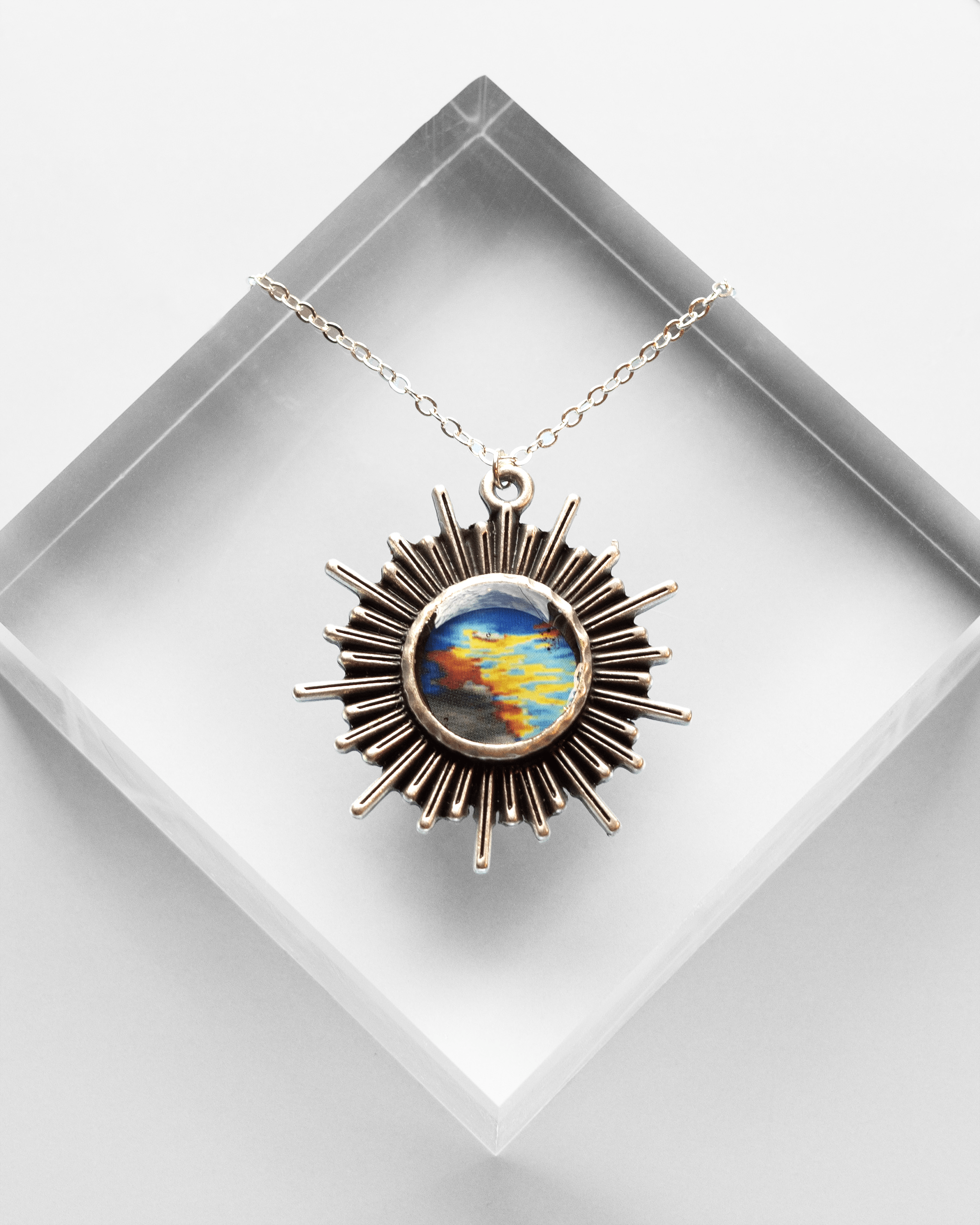 Handmade ultrasound heart necklace featuring real heart imagery. Vibrant sun shaped anatomical science jewelry gift for women in STEM and medicine.