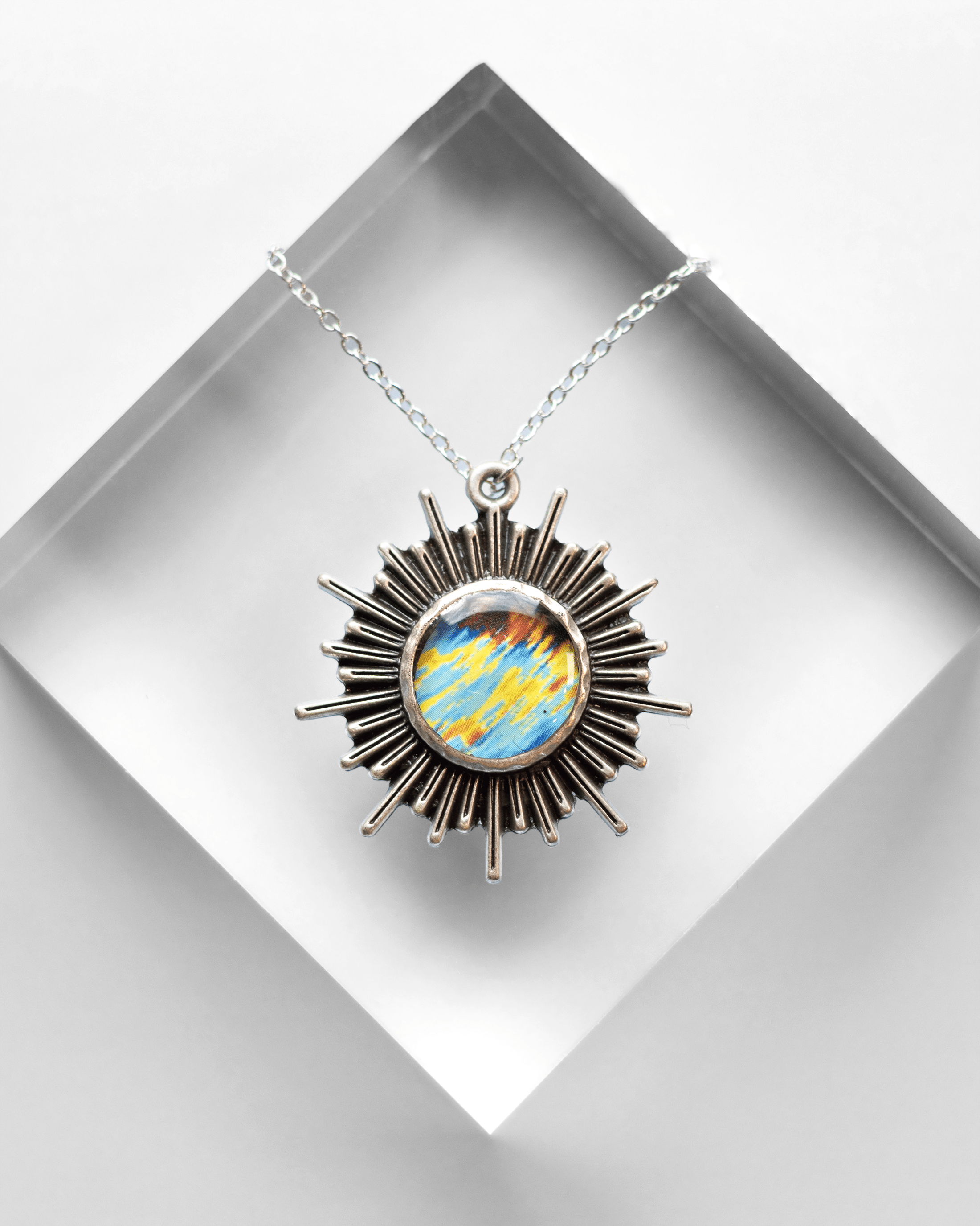 Handmade ultrasound heart necklace featuring real heart imagery. Vibrant sun shaped anatomical science jewelry gift for women in STEM and medicine. Option B.