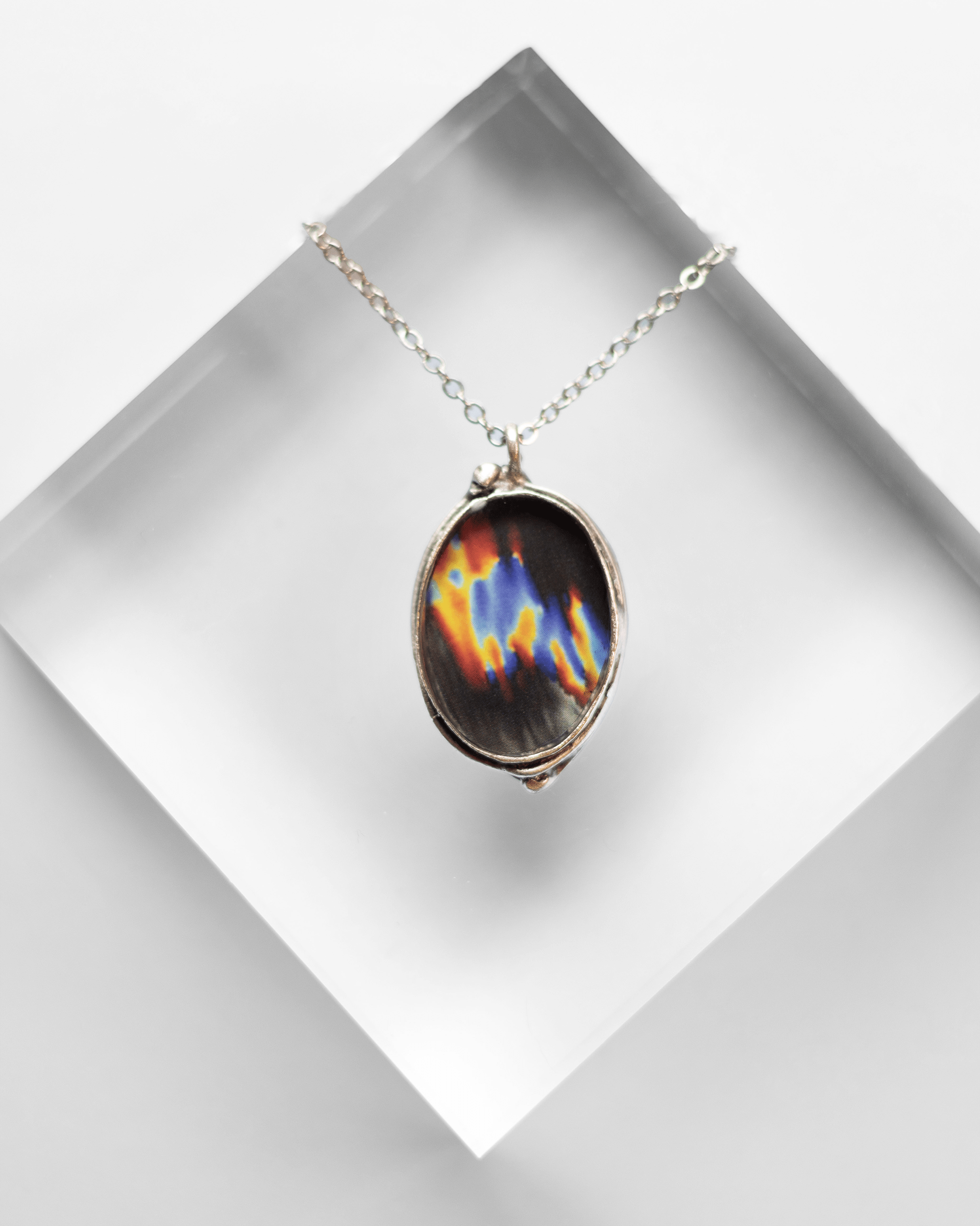 Ultrasound heart necklace handmade in resin and gold-tone finish. Colorful and elegant science jewelry celebrating love, anatomy, and art.