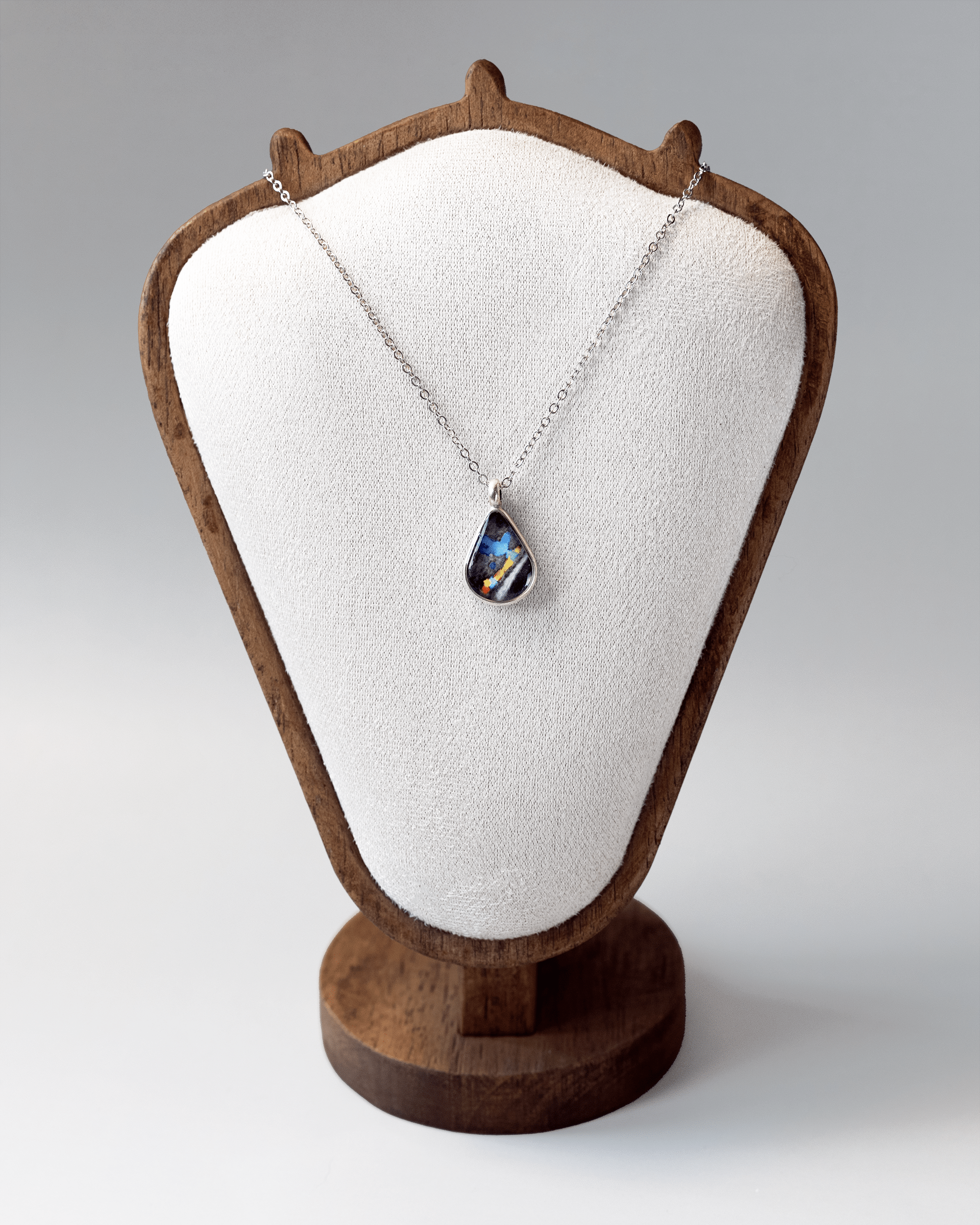 Heartbeat Necklace – Ultrasound Jewelry - Quantum Sunshine. Handmade jewelry featuring vivid ultrasound sealed in resin. Science-inspired wearable art and meaningful science gift for doctors and STEM professionals. On bust.