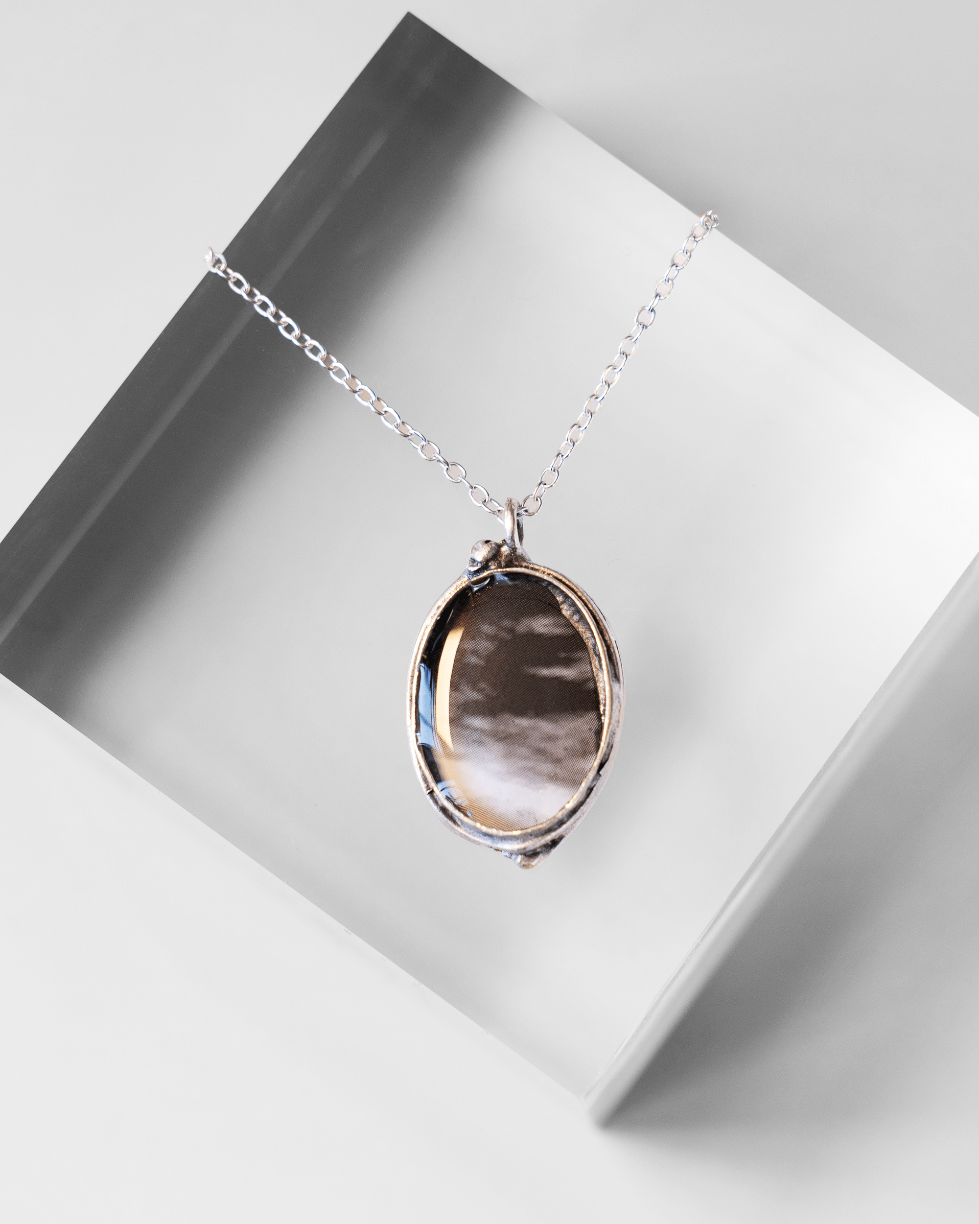 Handmade ultrasound heart necklace in resin and silver-plated brass. Anatomical science jewelry gift inspired by motion and vitality.