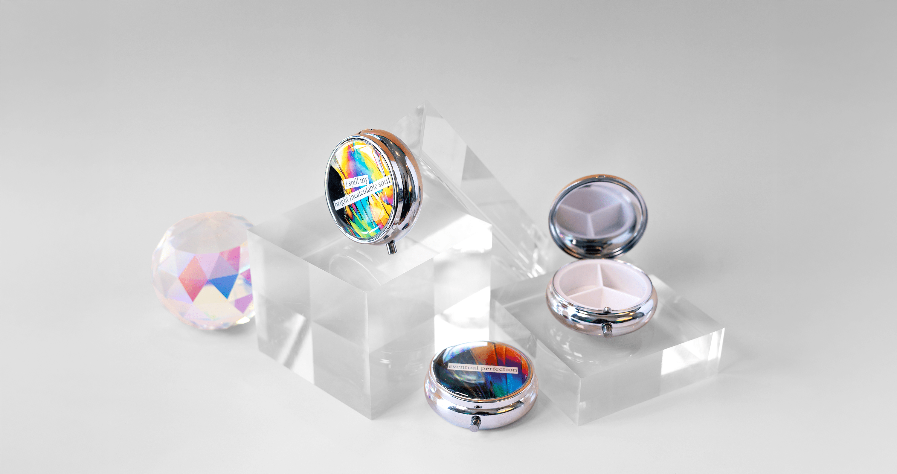 Neglected Sentiments - Dopamine Pill Case - Quantum Sunshine. Handmade pill case featuring vivid microscopy art sealed in resin. Science-inspired pillbox and meaningful Science gift for doctors and STEM professionals. Display.