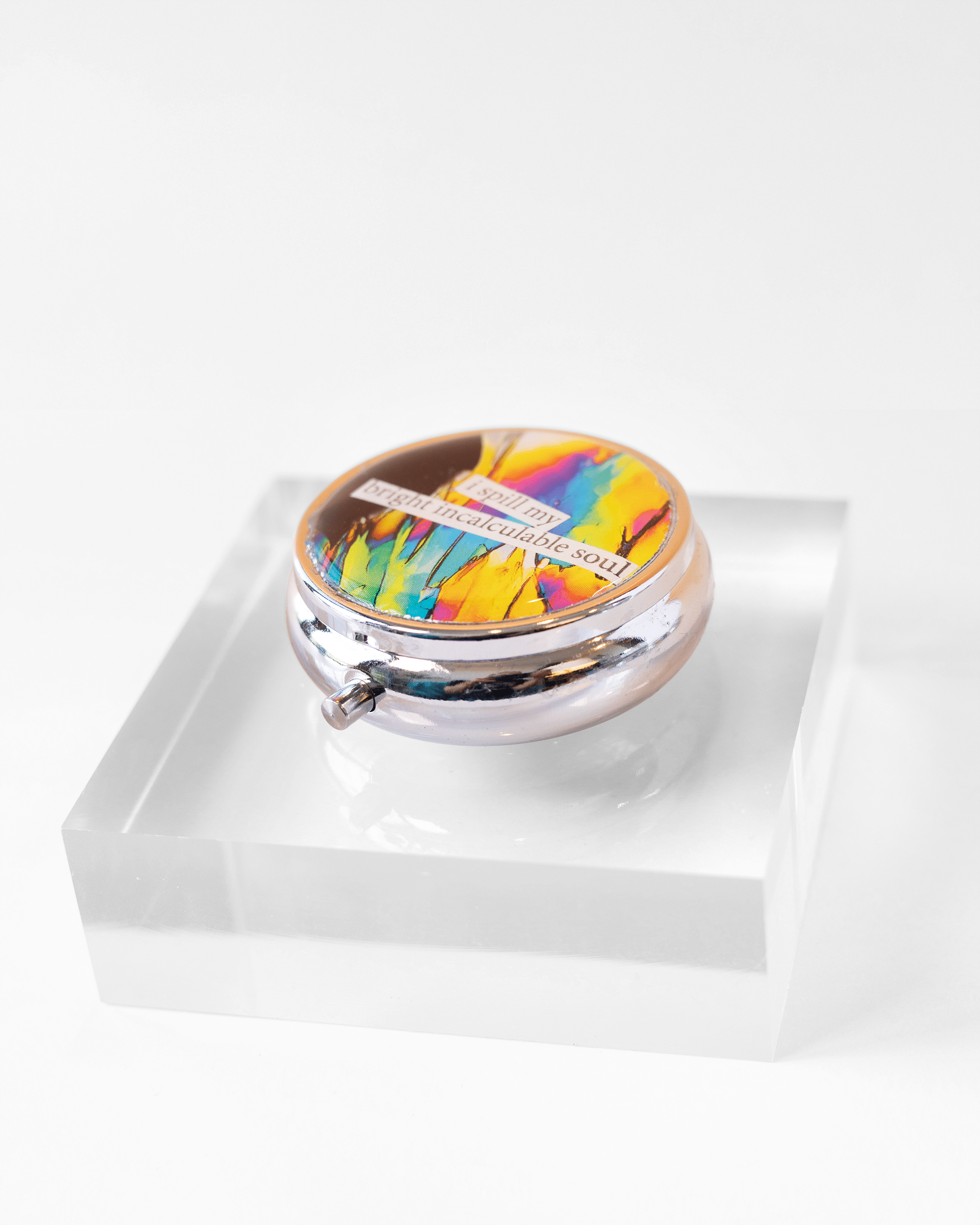 Handmade dopamine molecule pill case featuring vivid microscopy art sealed in resin. Science-inspired pillbox and meaningful STEM gift for thinkers and dreamers. Side.