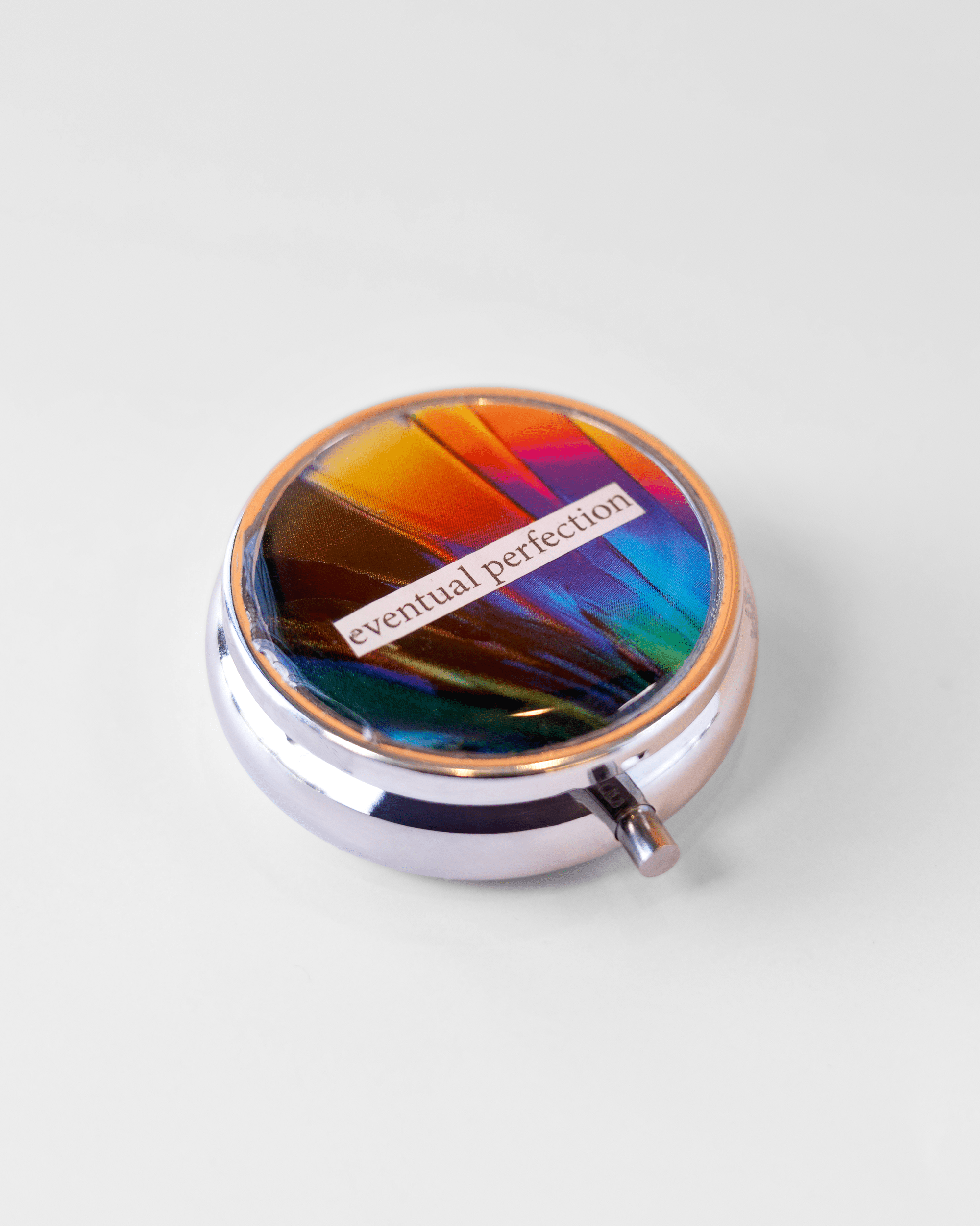 Eventual Perfection - Dopamine Pill case - Quantum Sunshine. Handmade dopamine pill case featuring vivid microscopy art sealed in resin. Science-inspired pillbox and meaningful STEM gift for thinkers and dreamers.