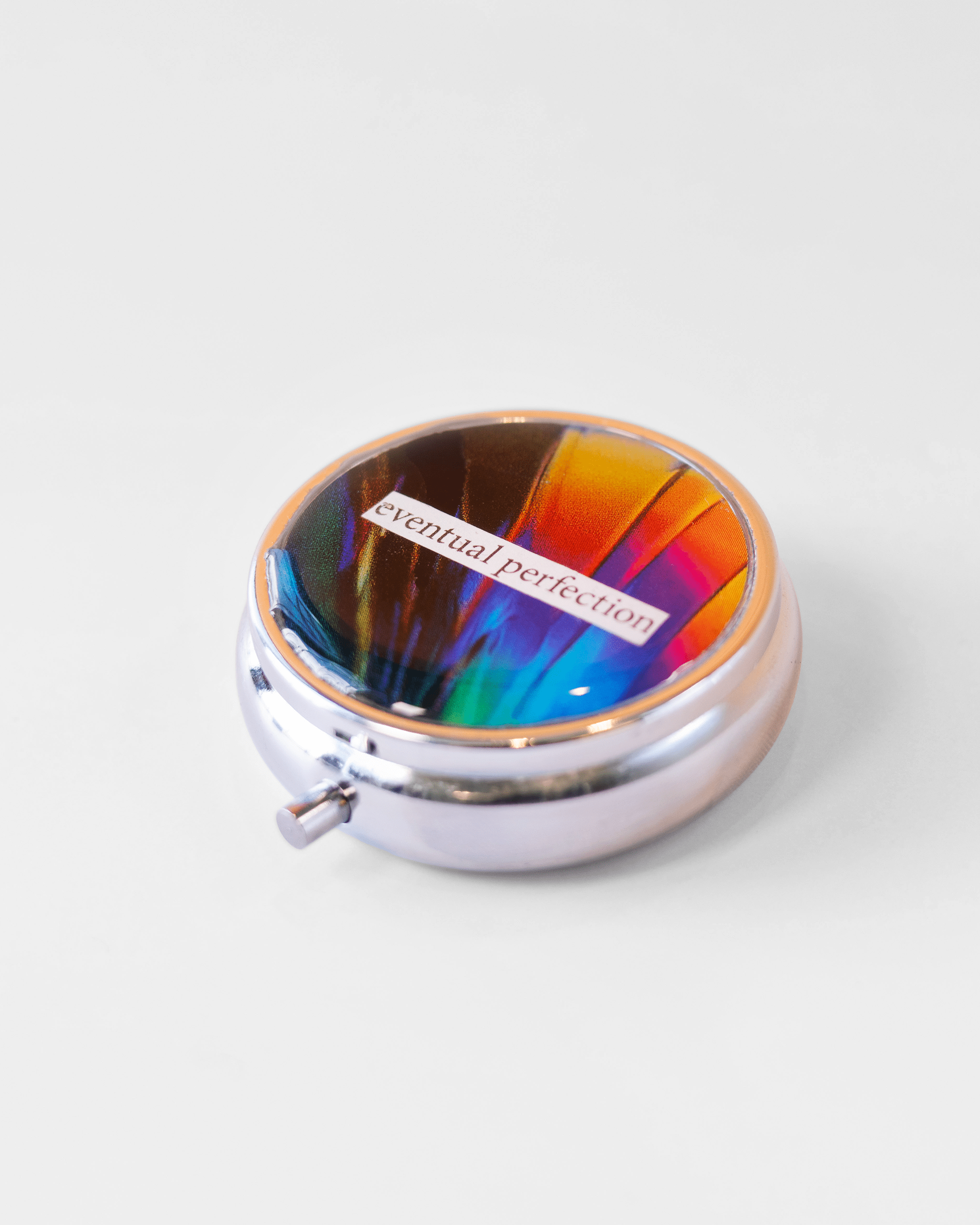 Eventual Perfection - Dopamine Pill case - Quantum Sunshine. Handmade dopamine pill case featuring vivid microscopy art sealed in resin. Science-inspired pillbox and meaningful STEM gift for thinkers and dreamers. Side.