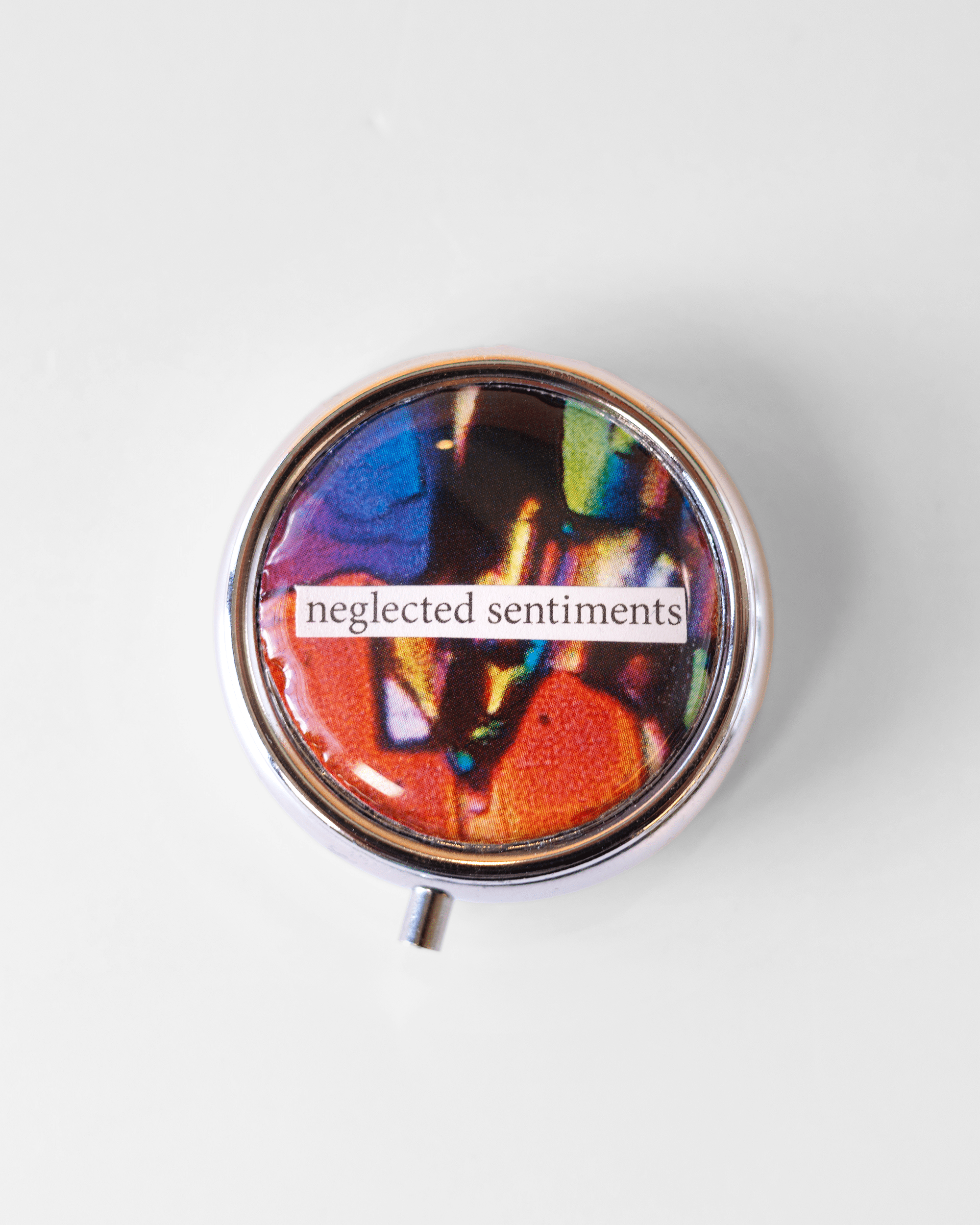 Sentimental - Pill Case - Quantum Sunshine. Handmade pill case featuring vivid microscopy art sealed in resin. Science-inspired pillbox and meaningful Science gift for doctors and STEM professionals.