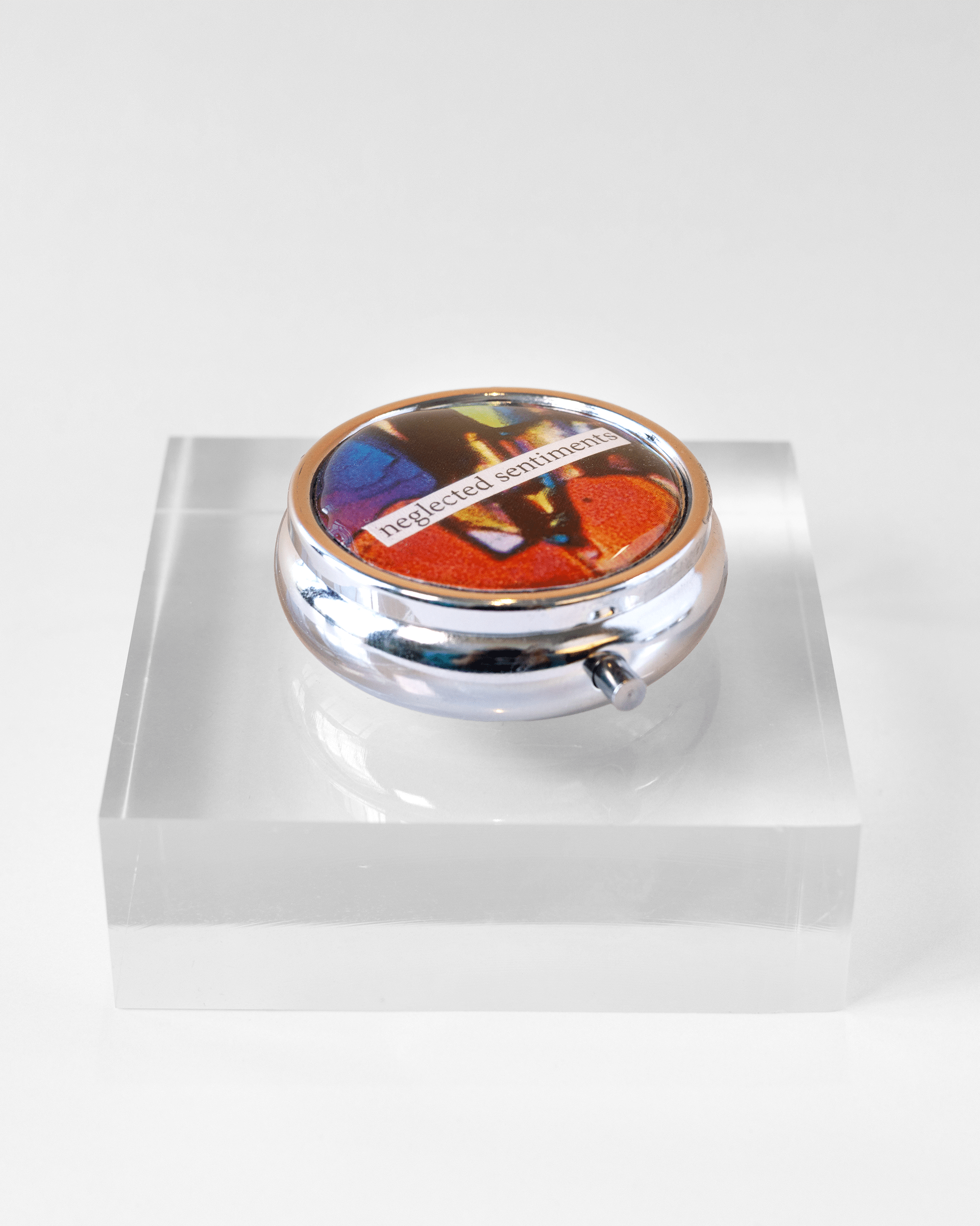 Sentimental - Pill Case - Quantum Sunshine. Handmade pill case featuring vivid microscopy art sealed in resin. Science-inspired pillbox and meaningful Science gift for doctors and STEM professionals. Side.