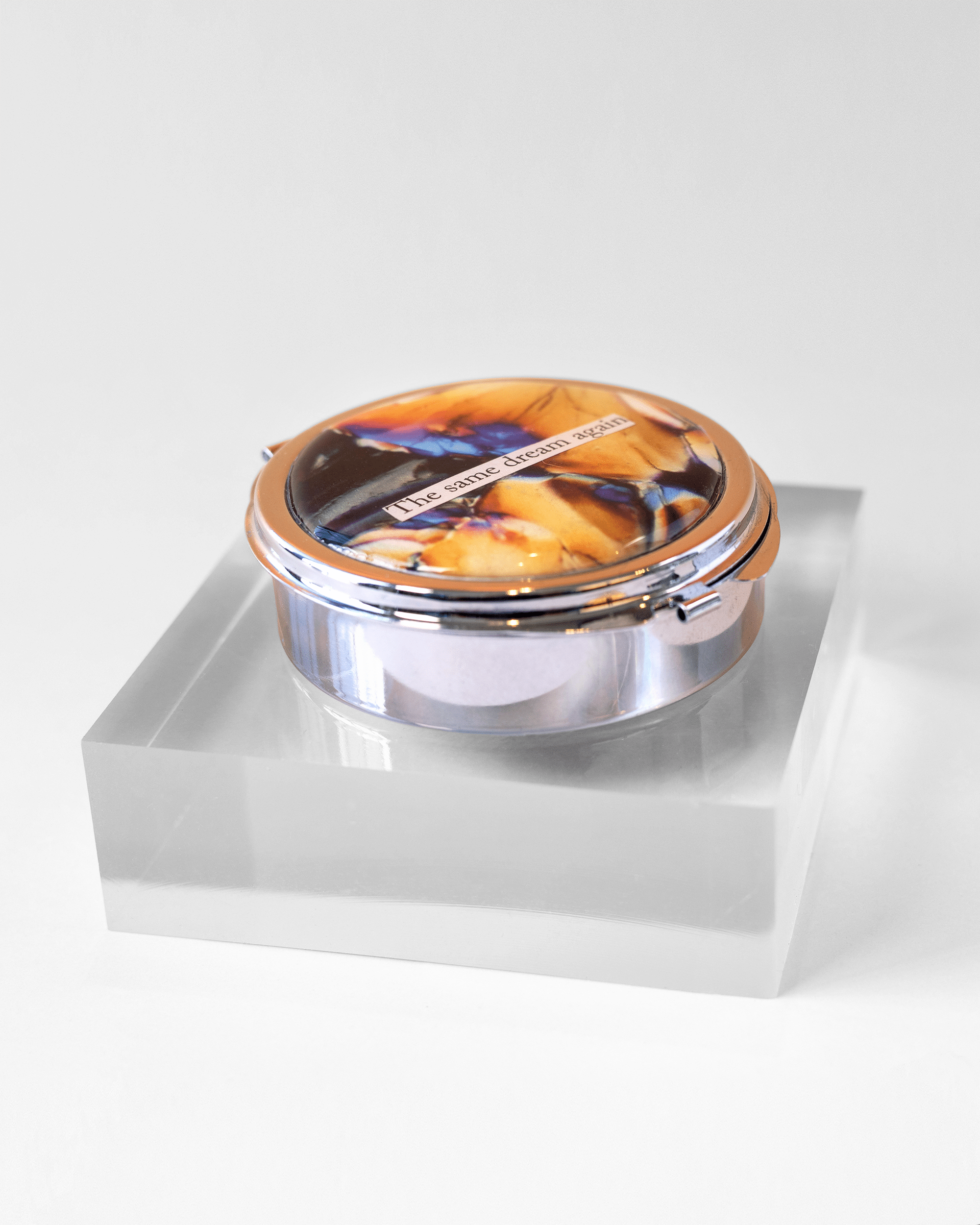 Recurring Dream - Large Pill Case - Quantum Sunshine. Handmade pill case featuring vivid microscopy art sealed in resin. Science-inspired pillbox and meaningful Science gift for doctors and STEM professionals. Side.