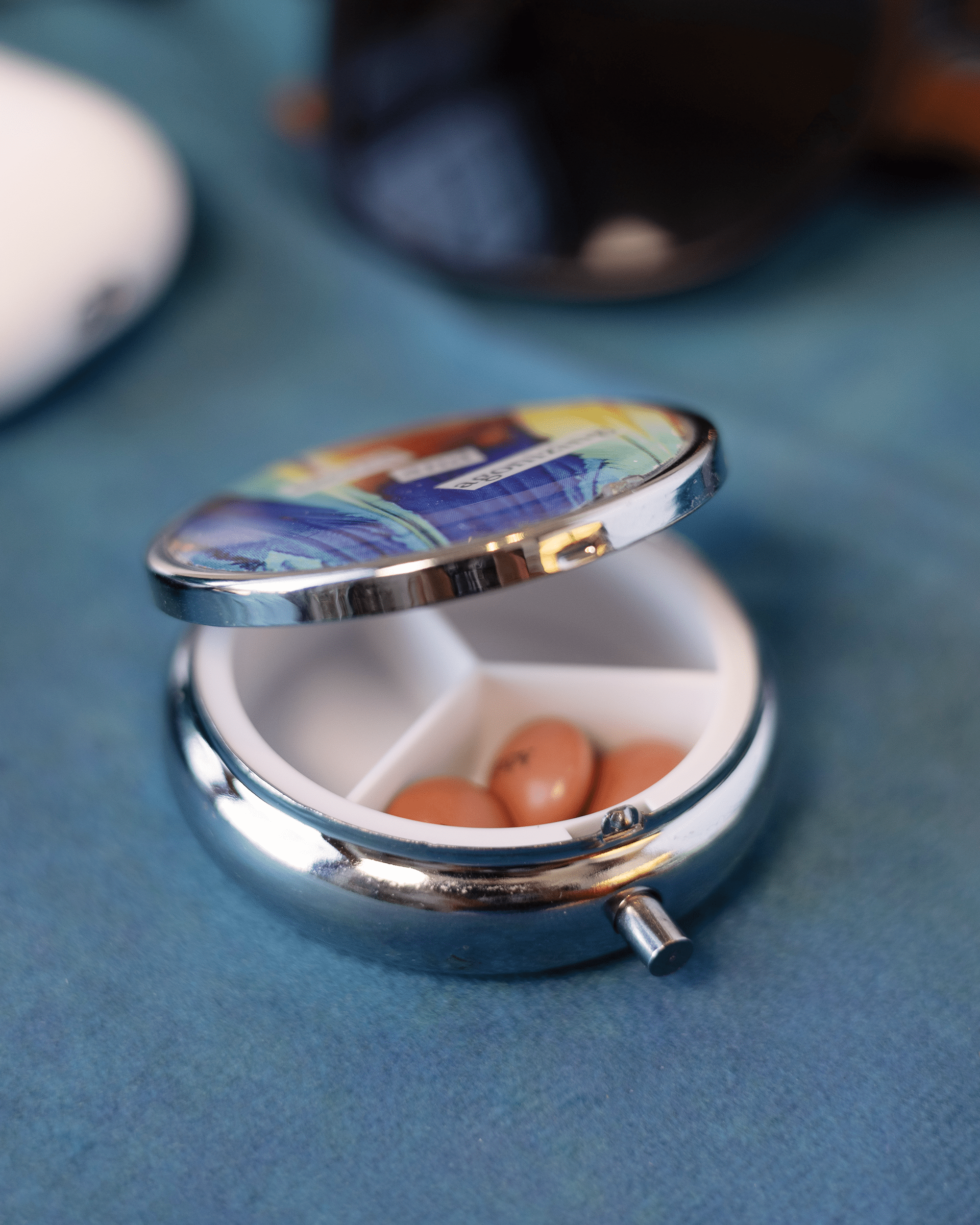 Sacred + Agonizing - Pill Case - Quantum Sunshine. Handmade pill case featuring vivid microscopy art sealed in resin. Science-inspired pillbox and meaningful Science gift for doctors and STEM professionals. Open.