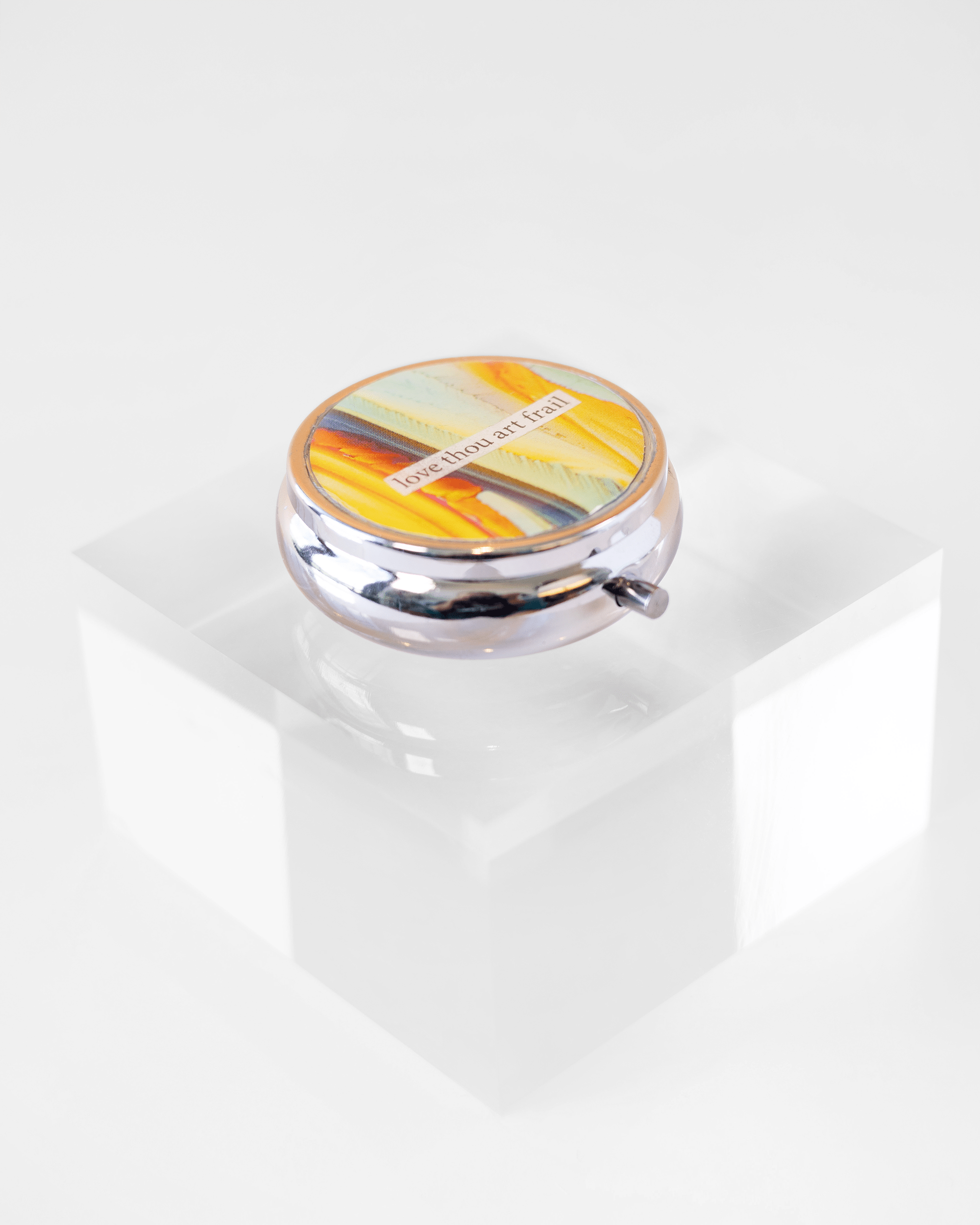 The Frailty of Love - Pill Case - Quantum Sunshine. Sacred + Agonizing - Pill Case - Quantum Sunshine. Handmade pill case featuring vivid microscopy art sealed in resin. Science-inspired pillbox and meaningful Science gift for doctors and STEM professionals. Side shot.