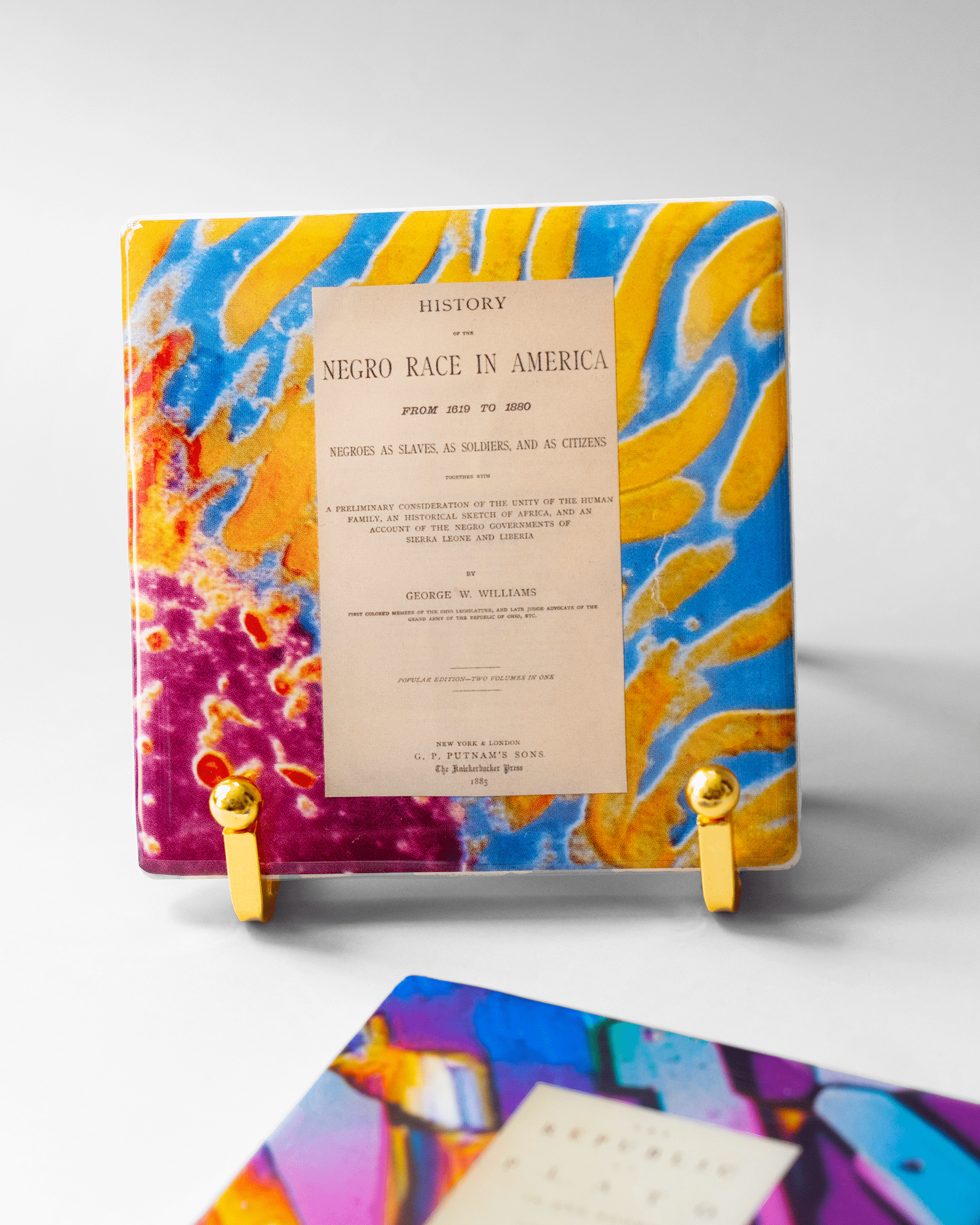 Histories Within x Microscopy | Display Coaster - Quantum Sunshine. Handmade art tile featuring vivid microscopy sealed in resin. Science-inspired wearable art and meaningful science gift for doctors and STEM professionals. History and resistance home decor. Front.